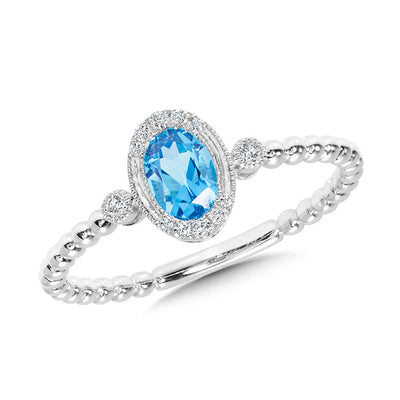 Oval Cut Blue Topaz and Diamond Ring in 14K White Gold