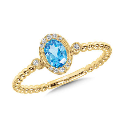 Oval Cut Blue Topaz and Diamond Ring in 14K Yellow Gold