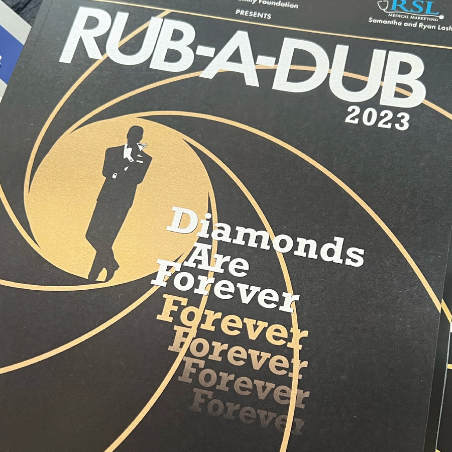 A picture of the 2023 Rub-A-Dub program with a James Bond logo interpolation with the phrase "Diamonds are forever"