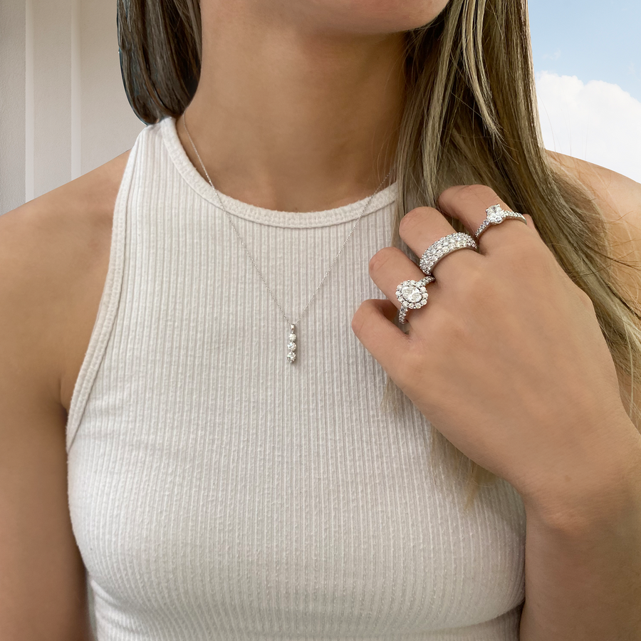 Women wearing a True Fire Lab Grown Diamond necklace and rings.