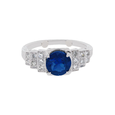 Estate Diamond Flanked Round Blue Sapphire Ring in Platinum
