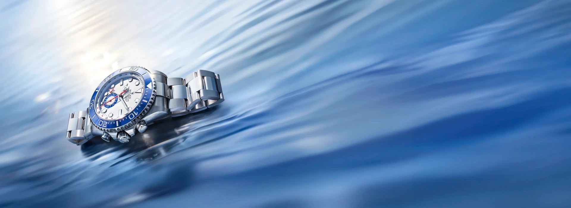 Yacht-Master-II | M126680-0001 on a blue watery and rippling background