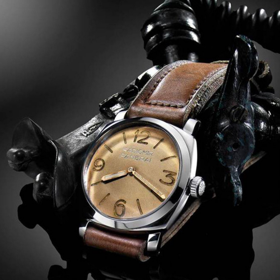 Panerai watch with brown leather strap and gold face 