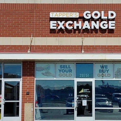 Storefront with 'Tapper's Gold Exchange' sign on a brick building.