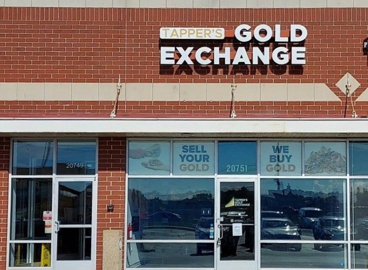 Storefront with 'Tapper's Gold Exchange' sign on a brick building.