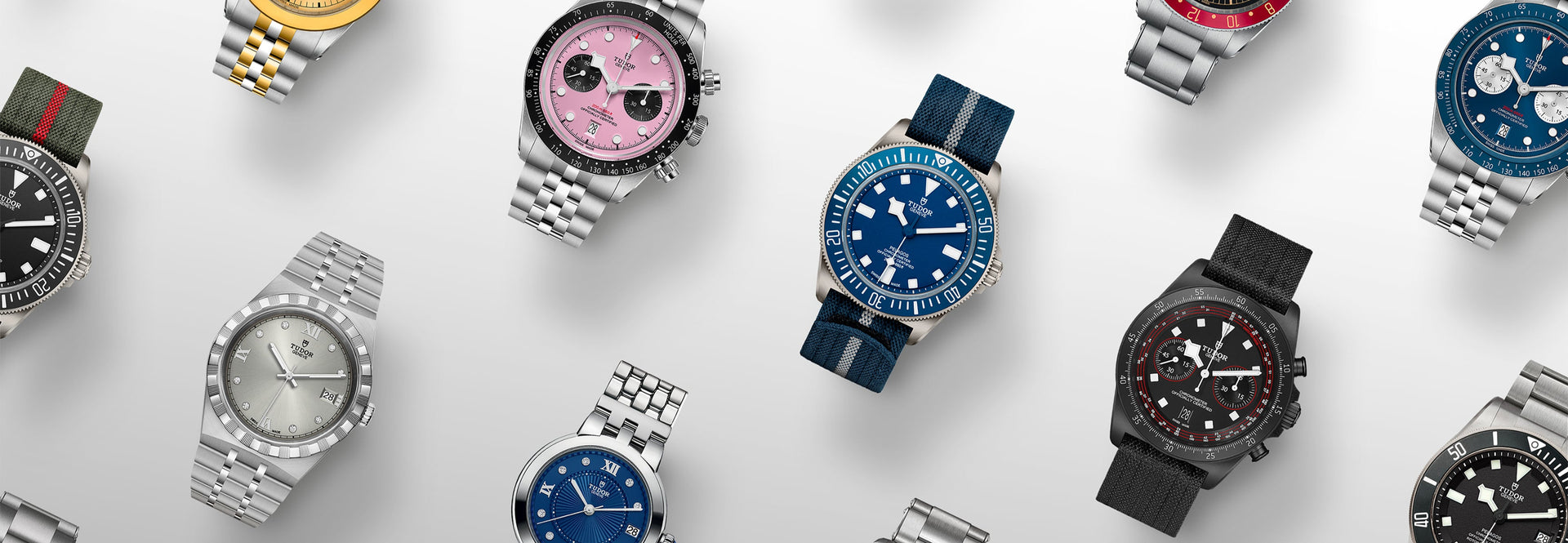 Various watches with different designs and colors on a light gray background