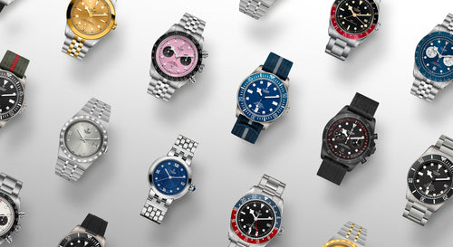 Various watches with different designs and colors on a light gray background
