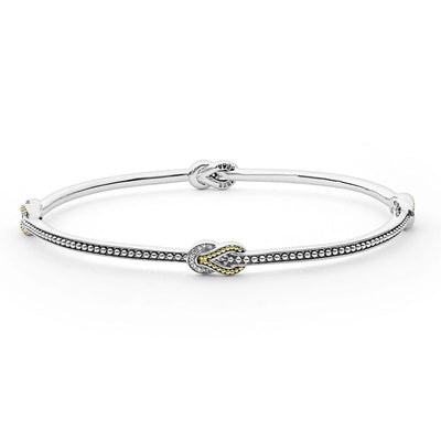 STERLING SILVER AND 18 KARAT GOLD KNOT BANGLE WITH DIAMONDS - Tapper's Jewelry 